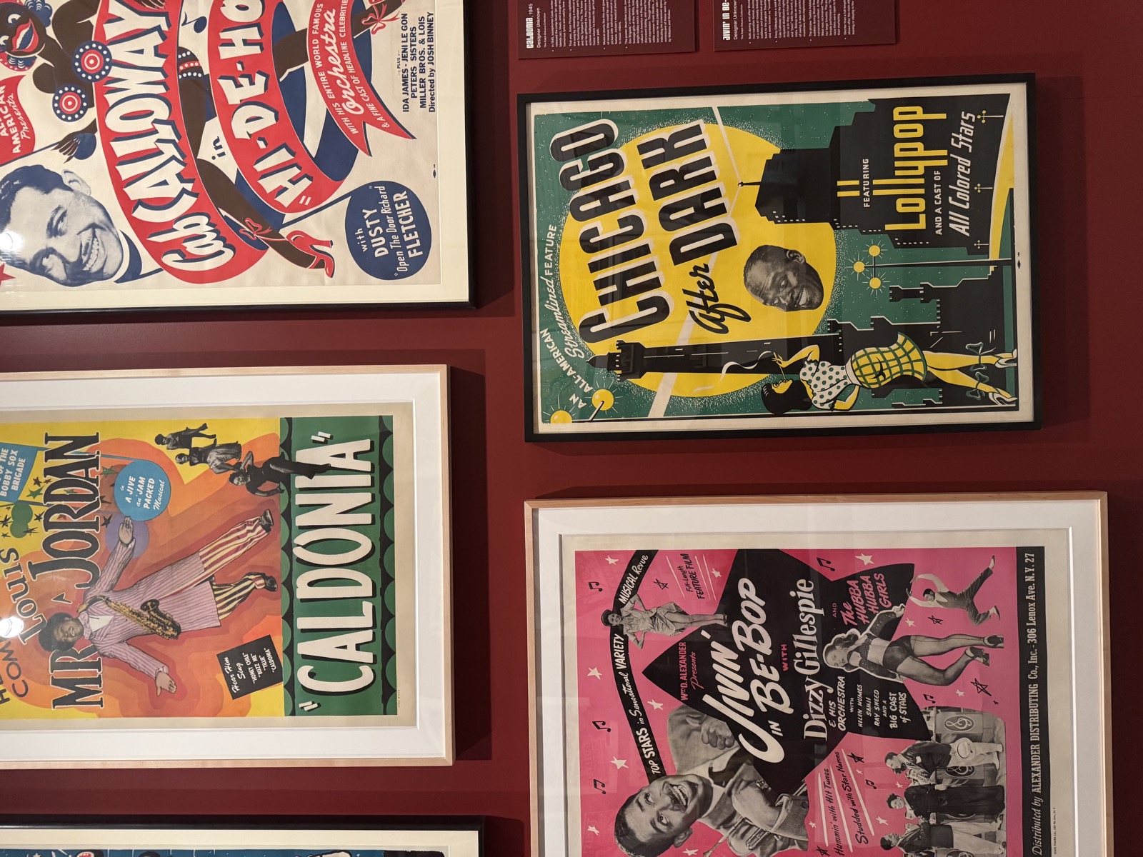 Wall of vintage jazz and variety show posters including Cab Calloway, Chicago After Dark, Caldonia, and Jivin' in Be-Bop