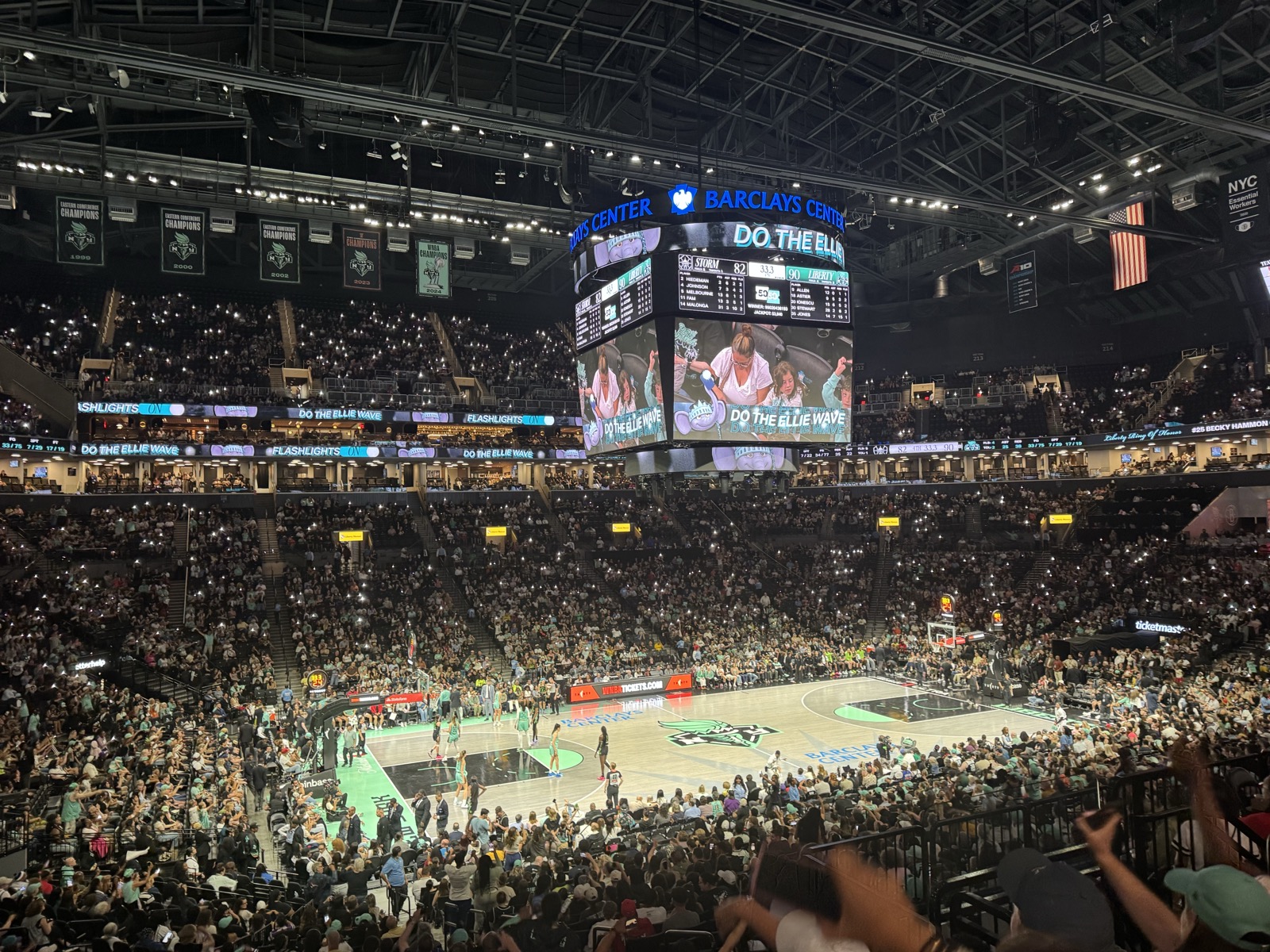 Liberty game at Barclays Center, packed arena, scoreboard showing Liberty 90, Storm 82